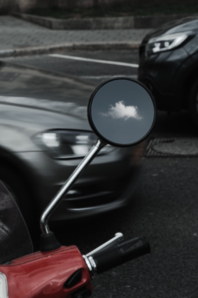 round black framed motorcycle side mirror